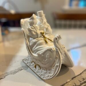 Elegant White and Gold Sleigh Figurine